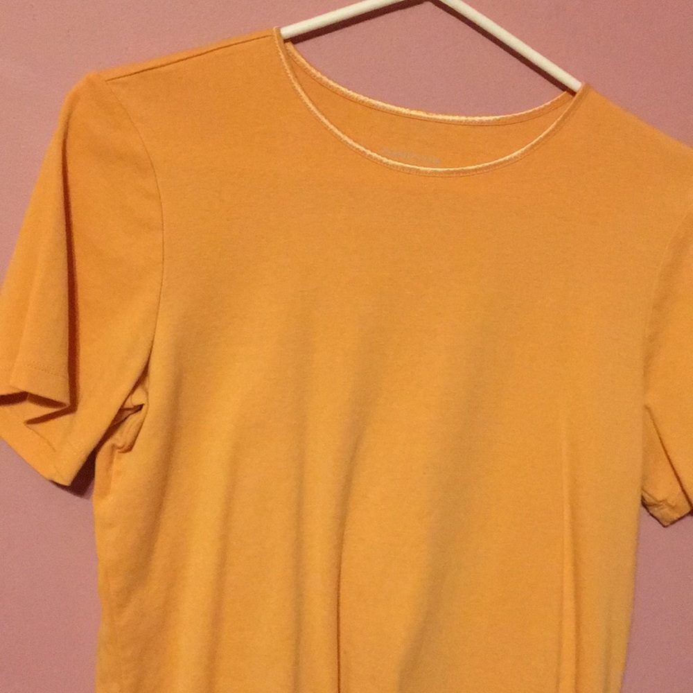 Light orange short sleeve knit top